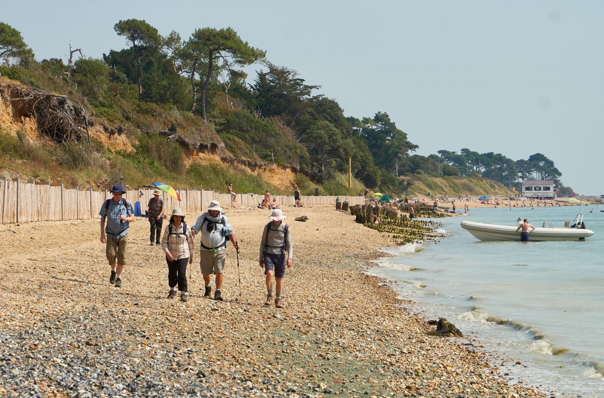 ramblers on shoreline at Lepe
